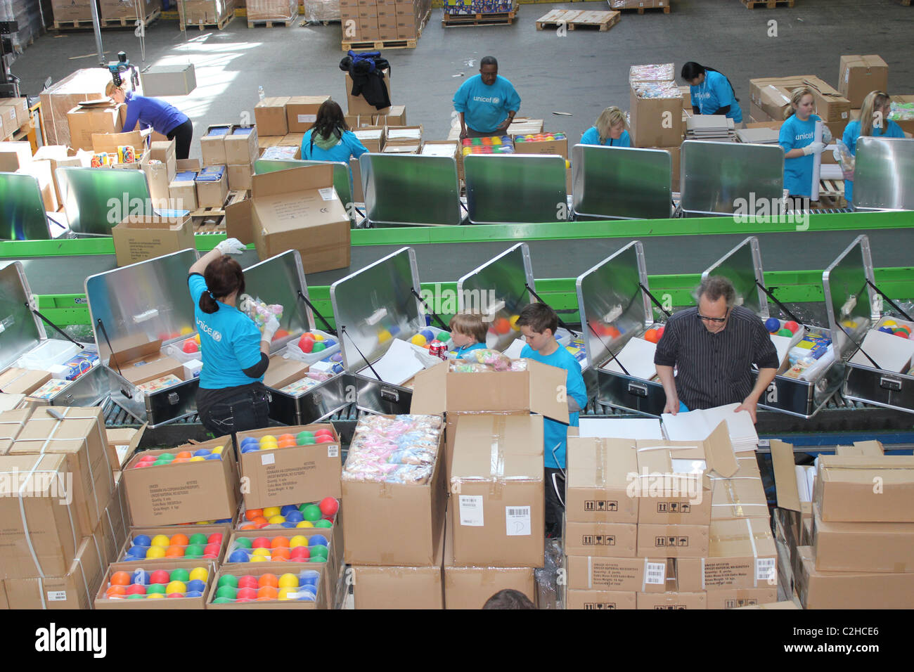 volunteers packing aid kits in unicef supply division in copenhagen C2HCE6